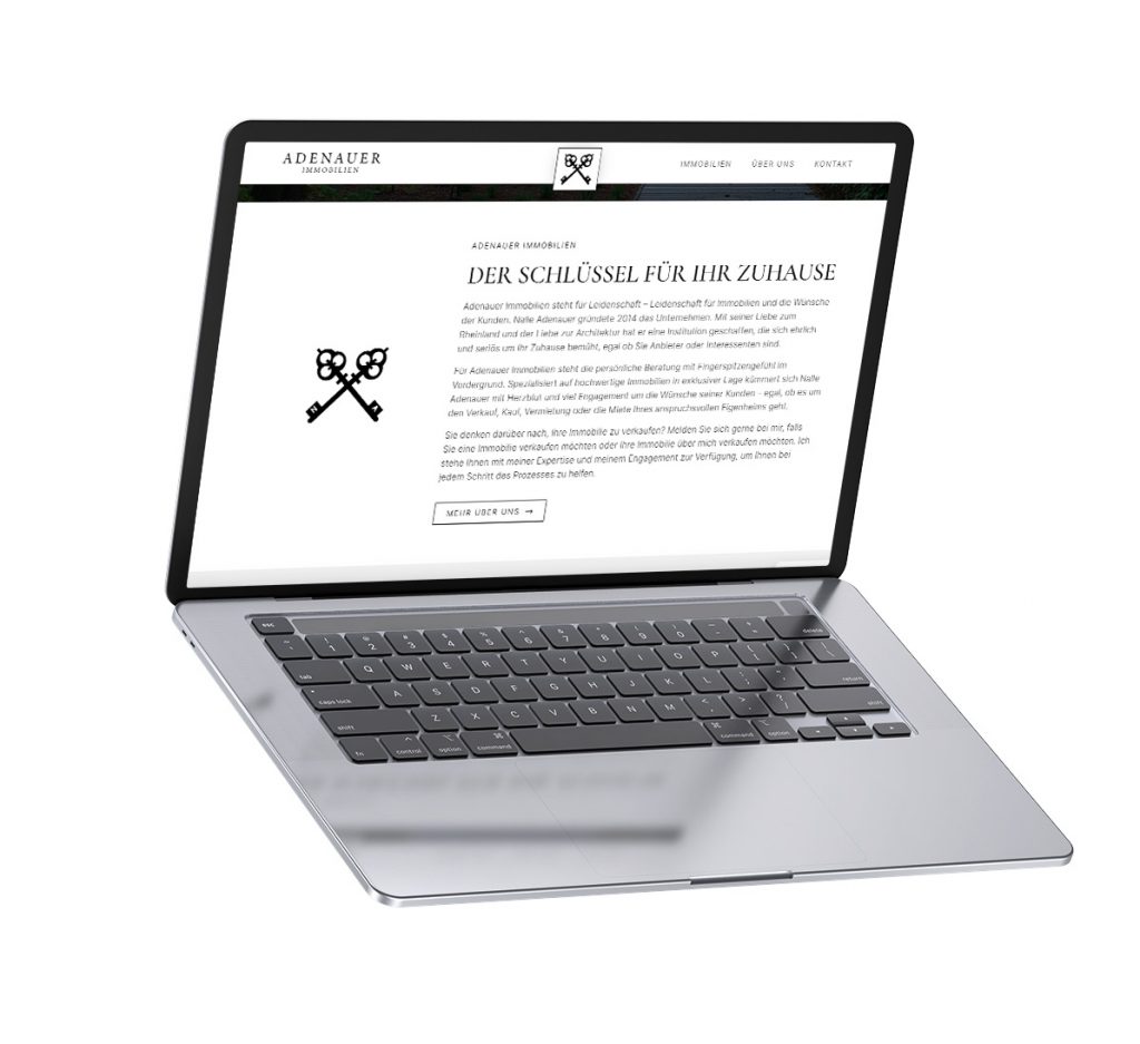 Laptop mit Ausschnitt des Webdesigns für Adenauer Immobilien